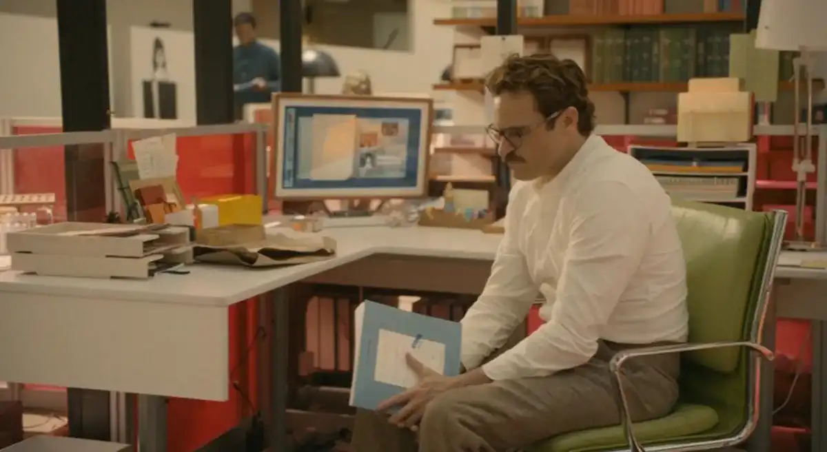 Théodore assis devant un bureau